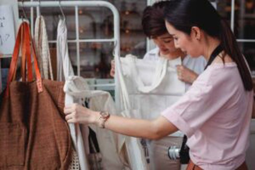 A woman looks at sustainable fabric bags