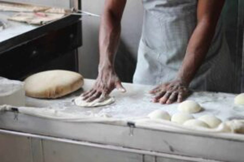 A baker making a batch of buns