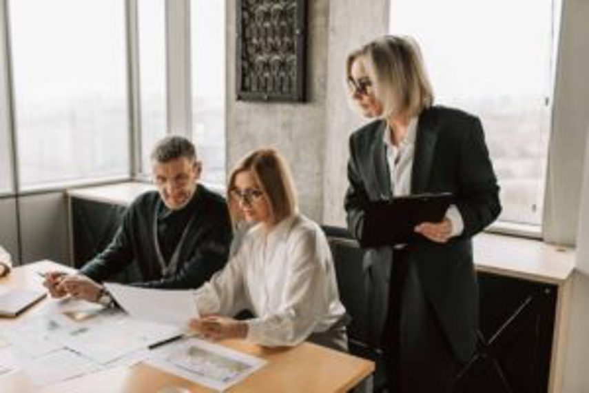 Managers looking at business figures in office