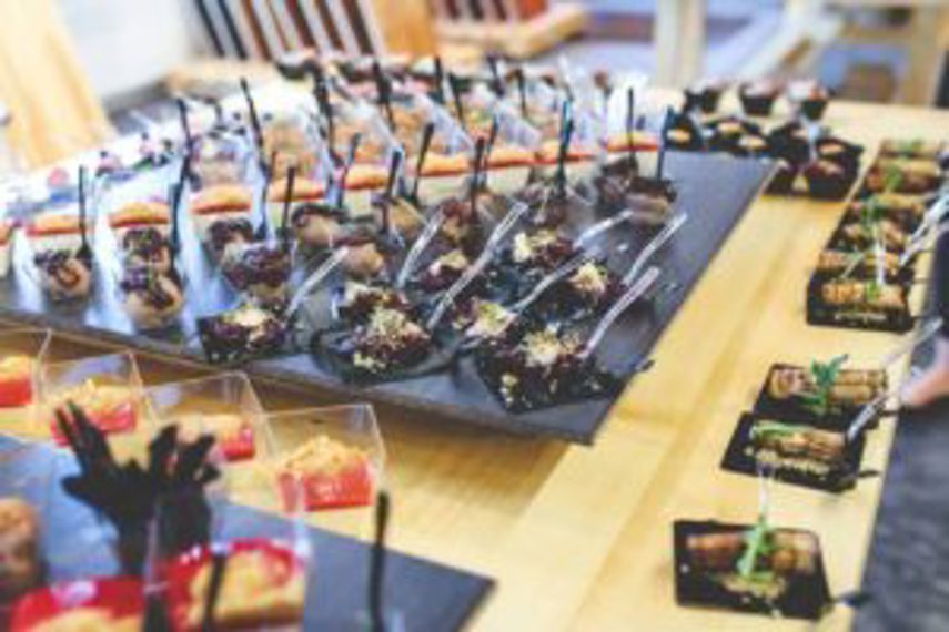 Catering platters of appetisers sit on a table