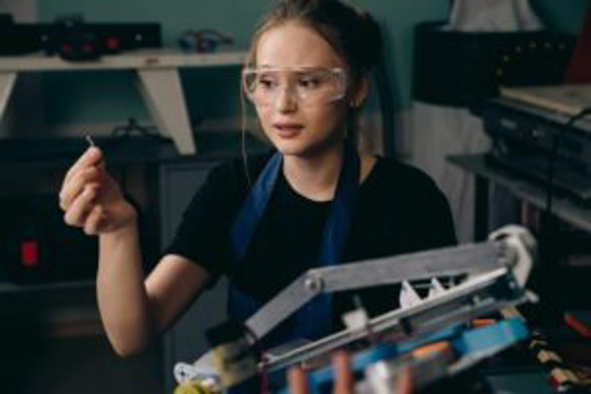 An employee removes clutter from the workspace