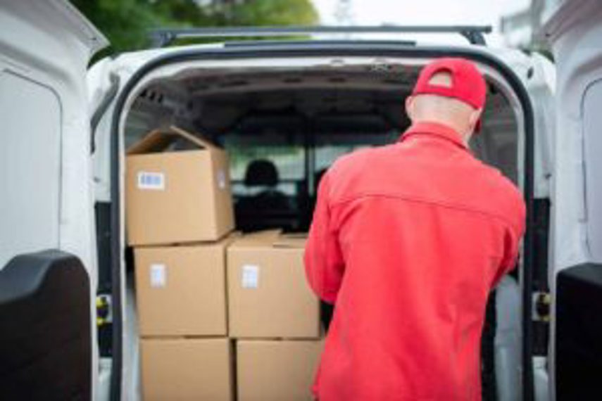 Sorting boxes of goods in a van