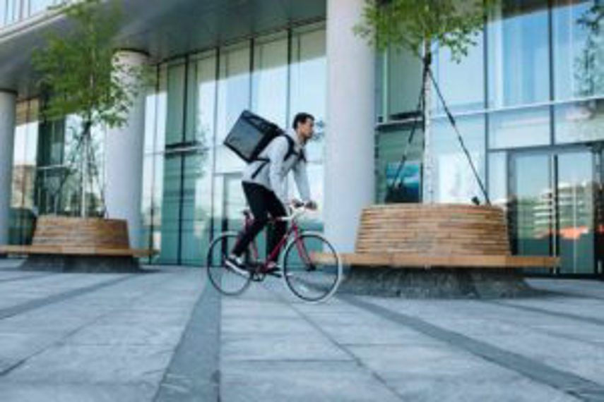 A man delivers an eCommerce order by bicycle