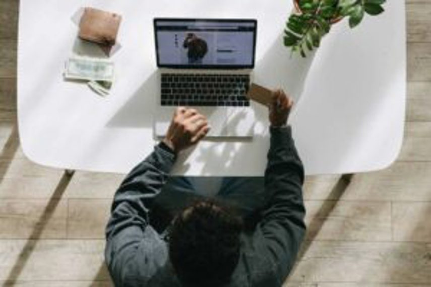 A man paying for his eCommerce purchase by credit card