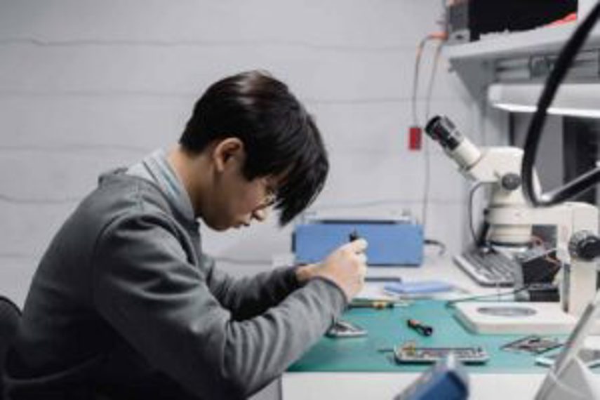 A man repairing a cellphone