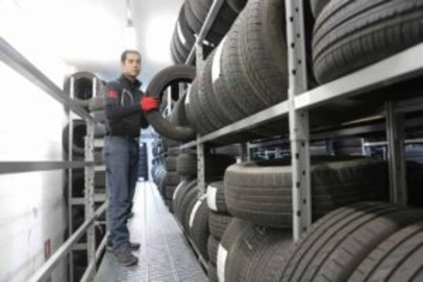 A man handling tyre inventory