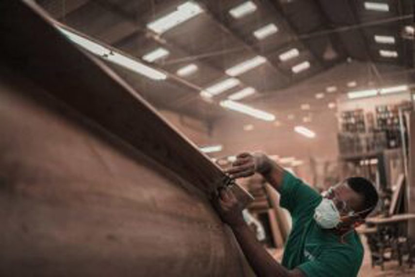 A man working on a product in a factory