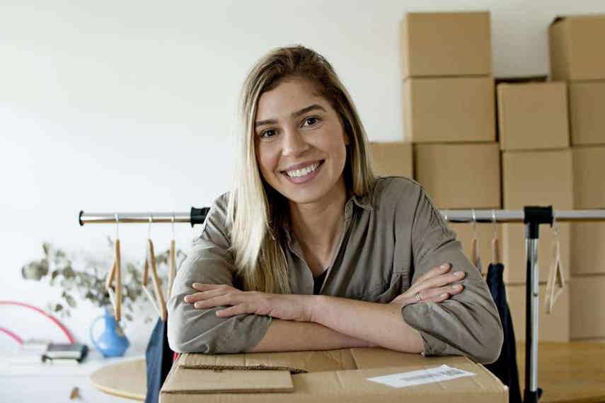 Happy woman fulfilling ecommerce orders online