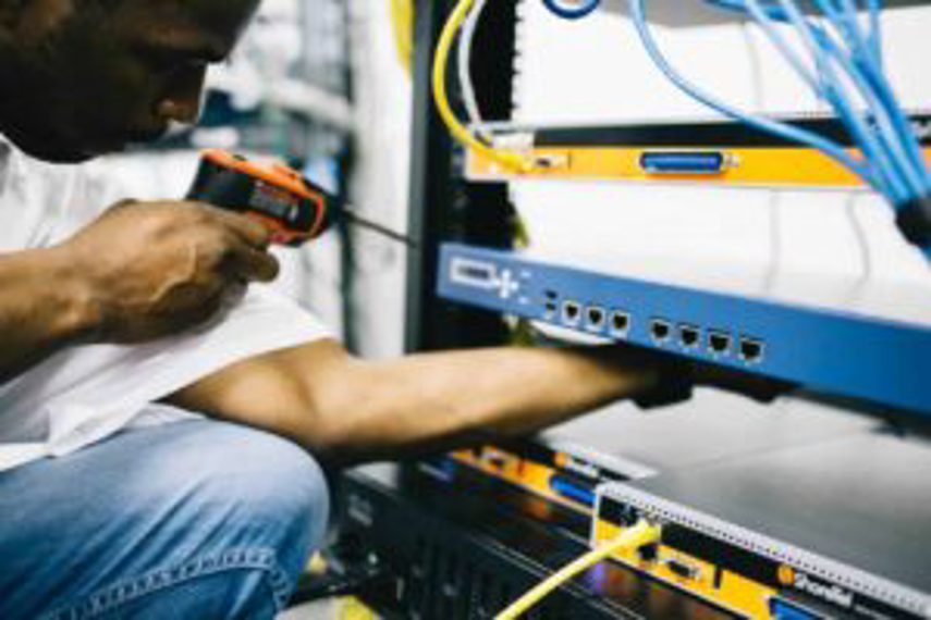 A man assembling electronic goods