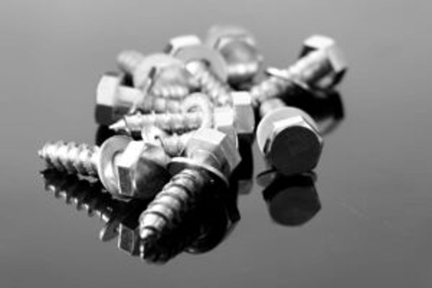 Screws sitting in a pile of 10