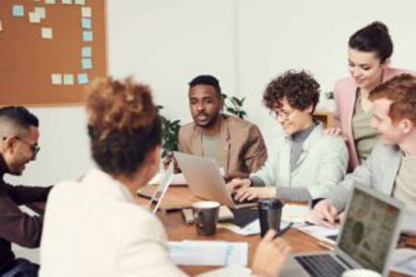 Staff talking at a desk