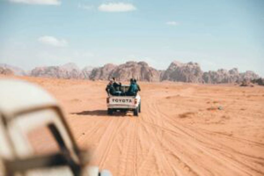 A Toyota ute driving in the desert