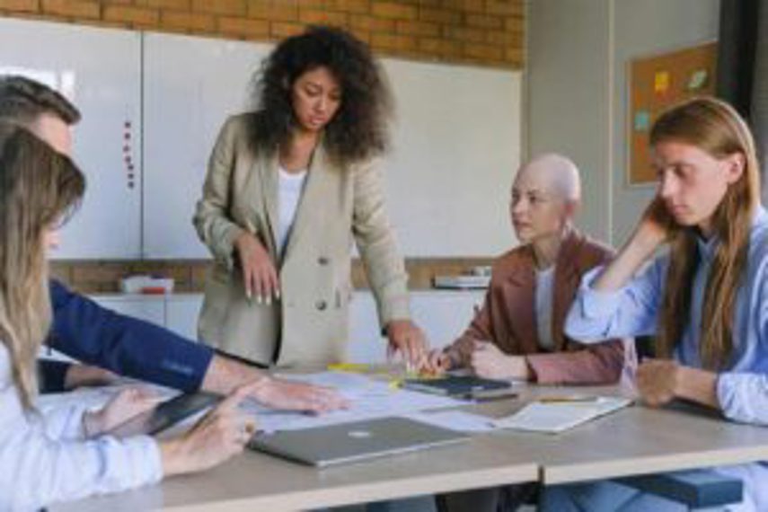 A manager talking to staff in a meeting