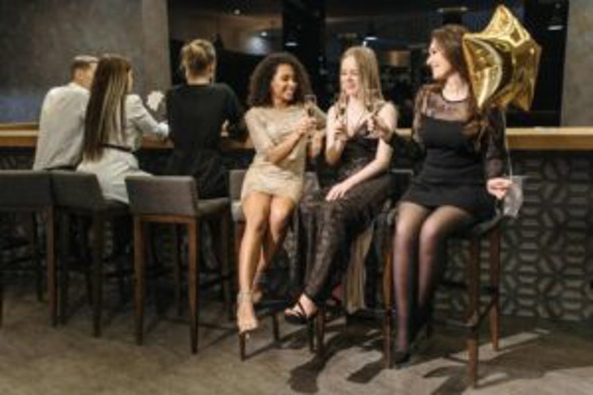 Women drinking spirits at a bar