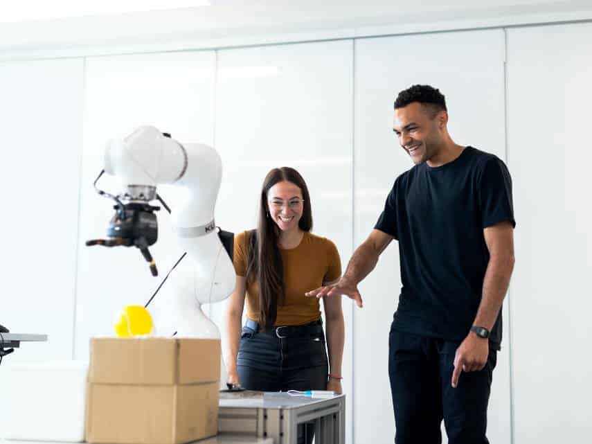 Automated warehouse order picking robot being used to retrieve items.