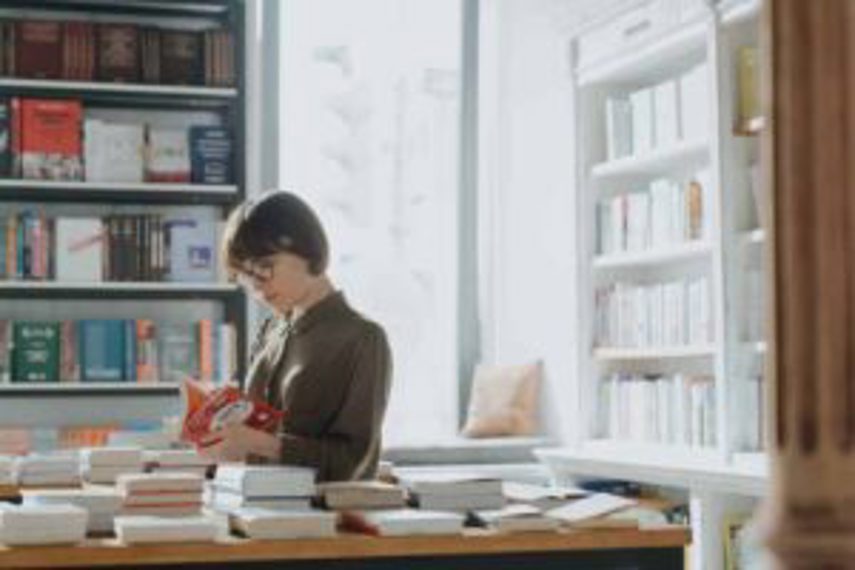 A woman browsing in a bookstore