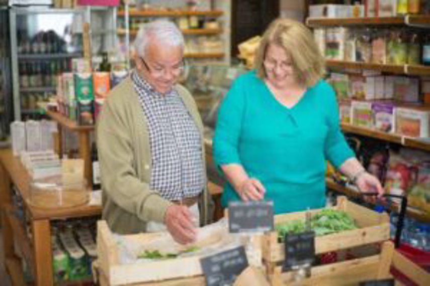 A couple looking at products in a supermarket