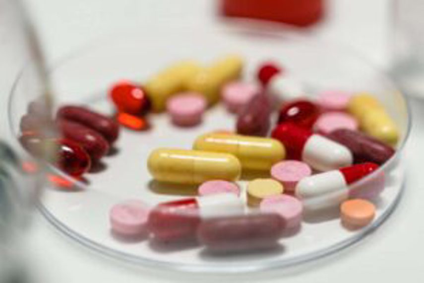 A range of pills in a dish