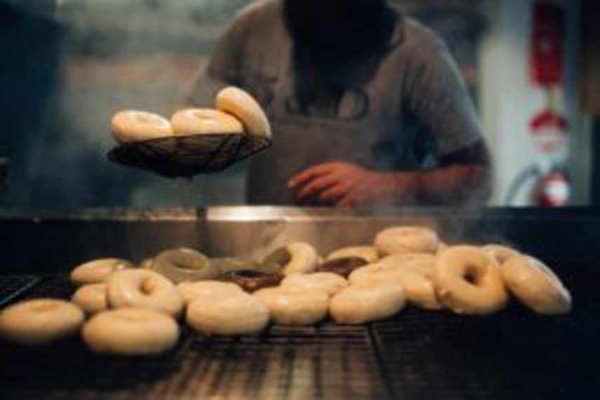 A person using food manufacturing software to make bagels 