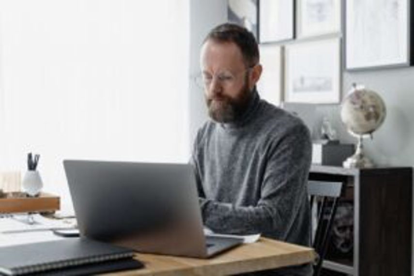 A man works in his office on a computer