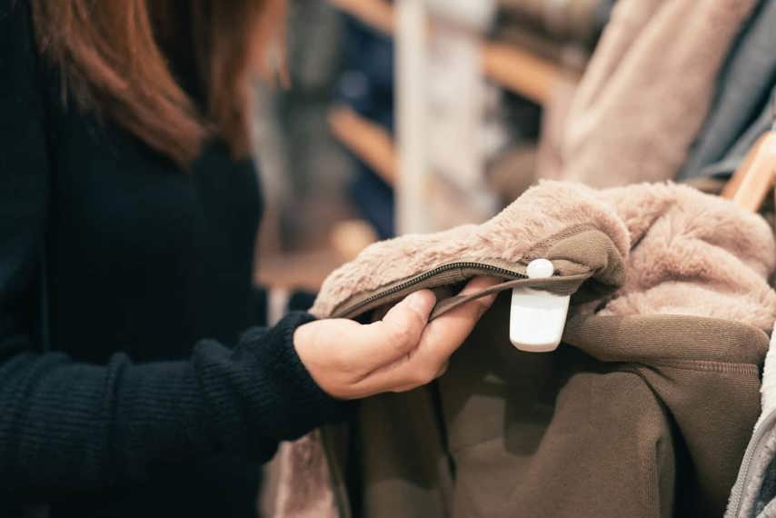 Shopper looking at coat