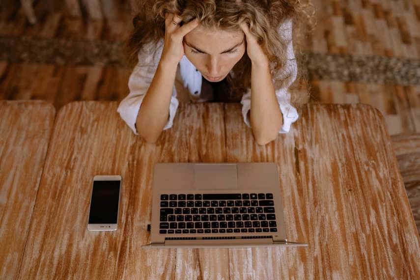 Frustrated worker with laptop